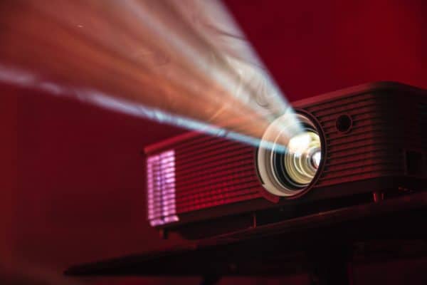 How to Plan a Funeral Slideshow: Projector in Dark Room