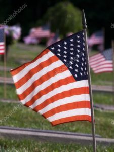 depositphotos_11435059-stock-photo-american-flag-in-graveyard