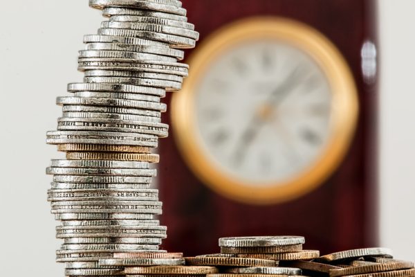 Future Interment Master Trust - coins with clock in background