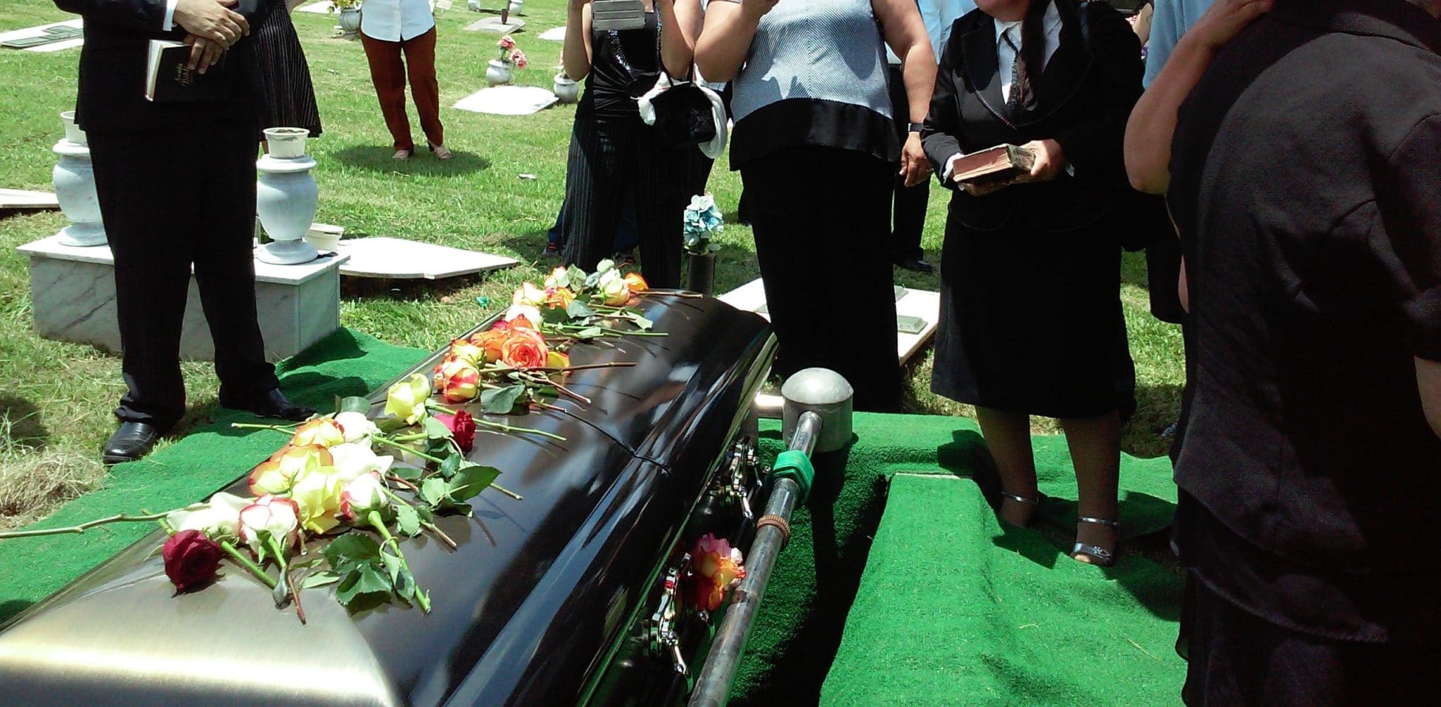 Casket with roses on top - Coping with Grief